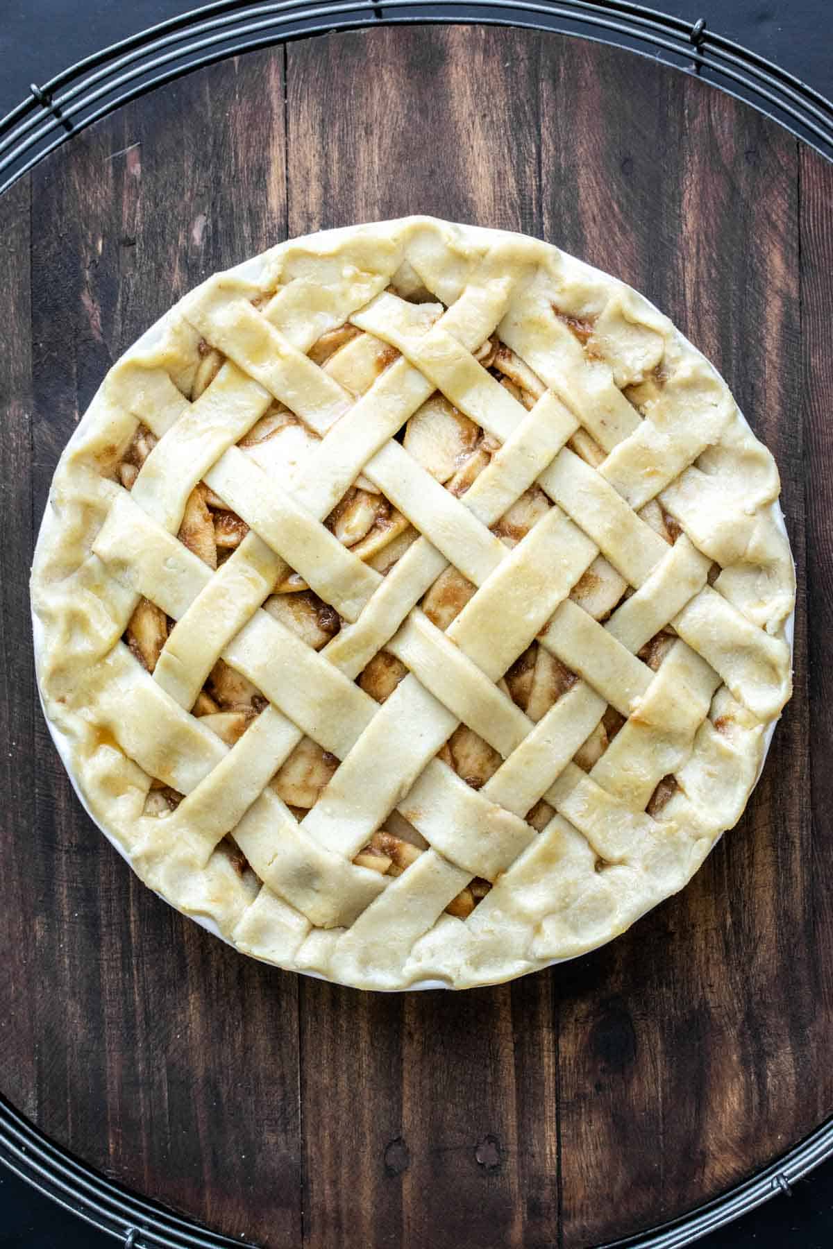 A whole raw lattice topped apple pie