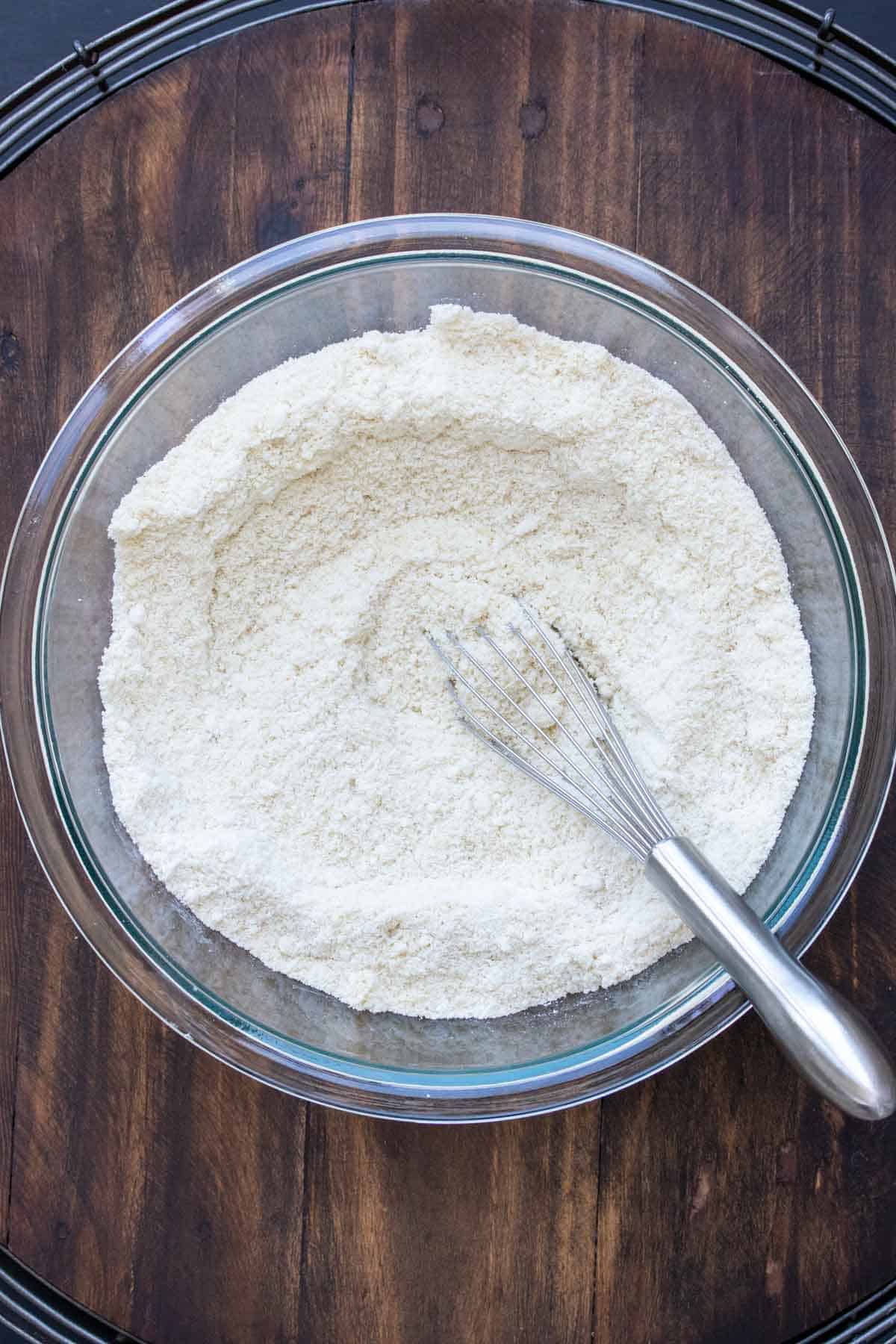 Whisk mixing flour in a glass bowl