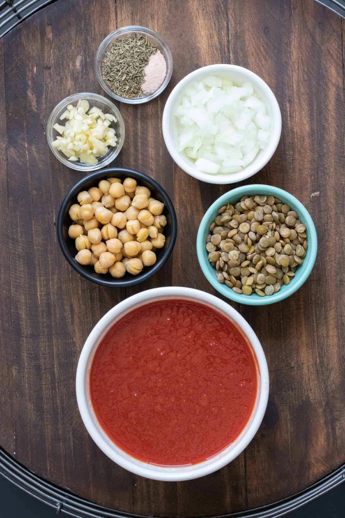 Bowls of ingredients to make bean based bolognese sauce