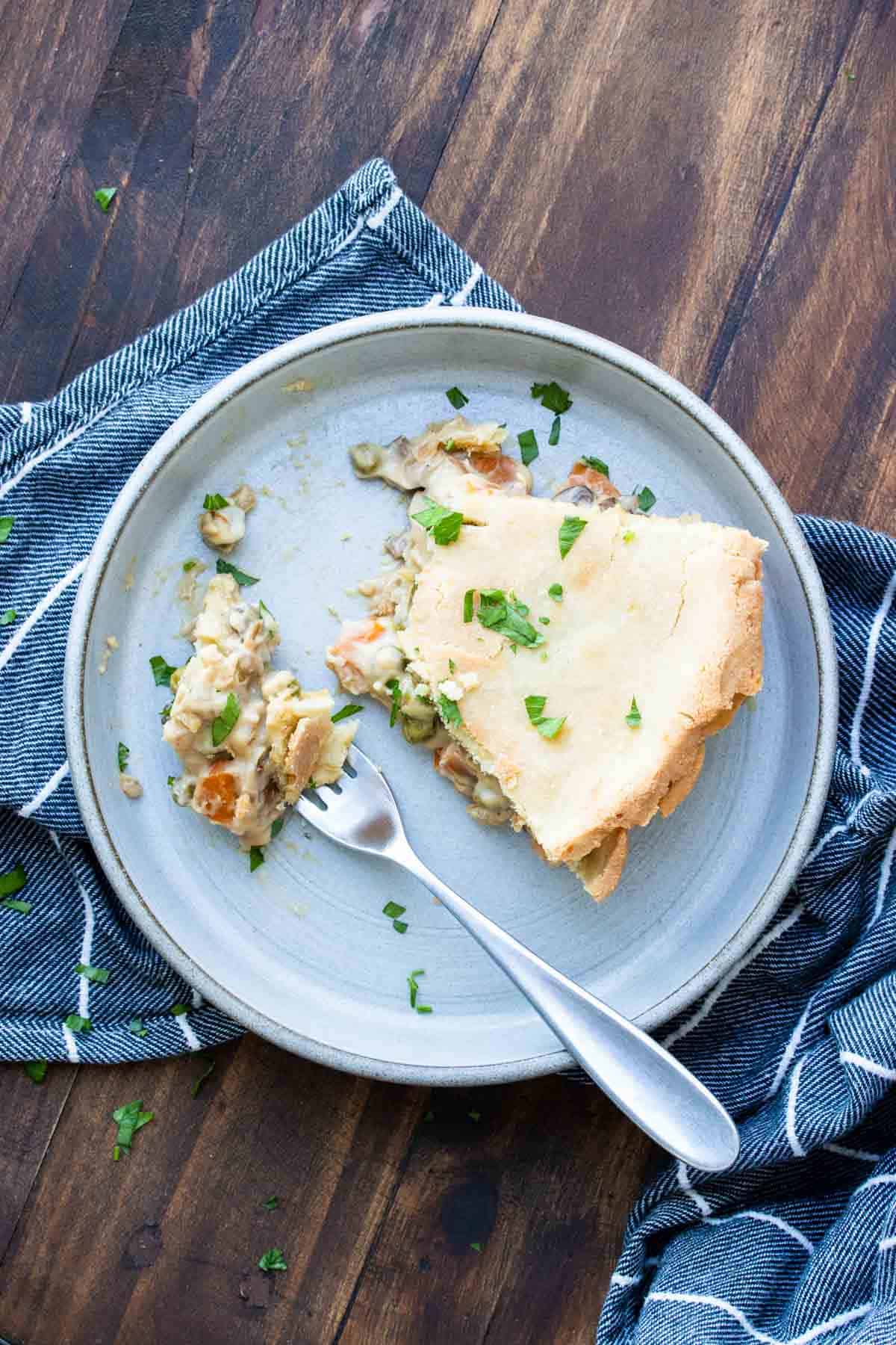 Top view of a fork getting a bite of vegetable pot pie