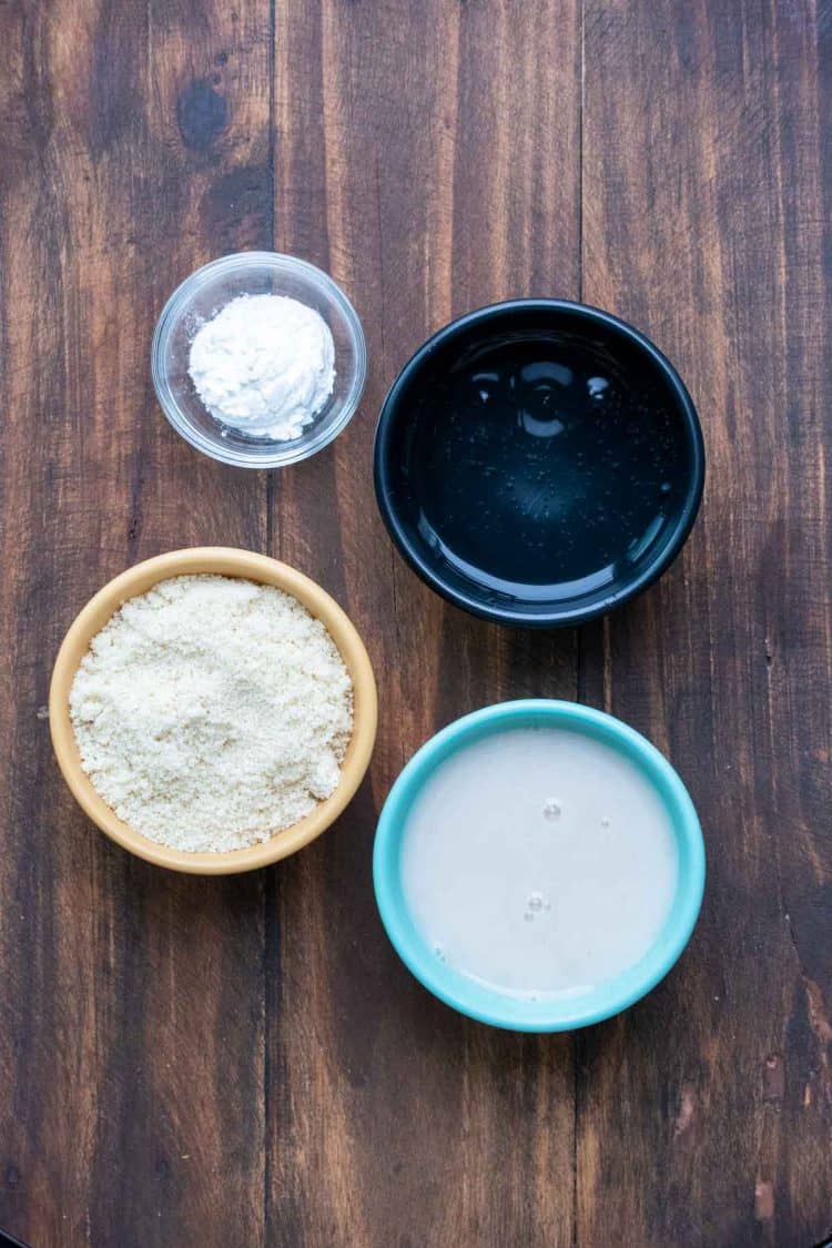 Bowls filled with ingredients to make a batter for onion rings