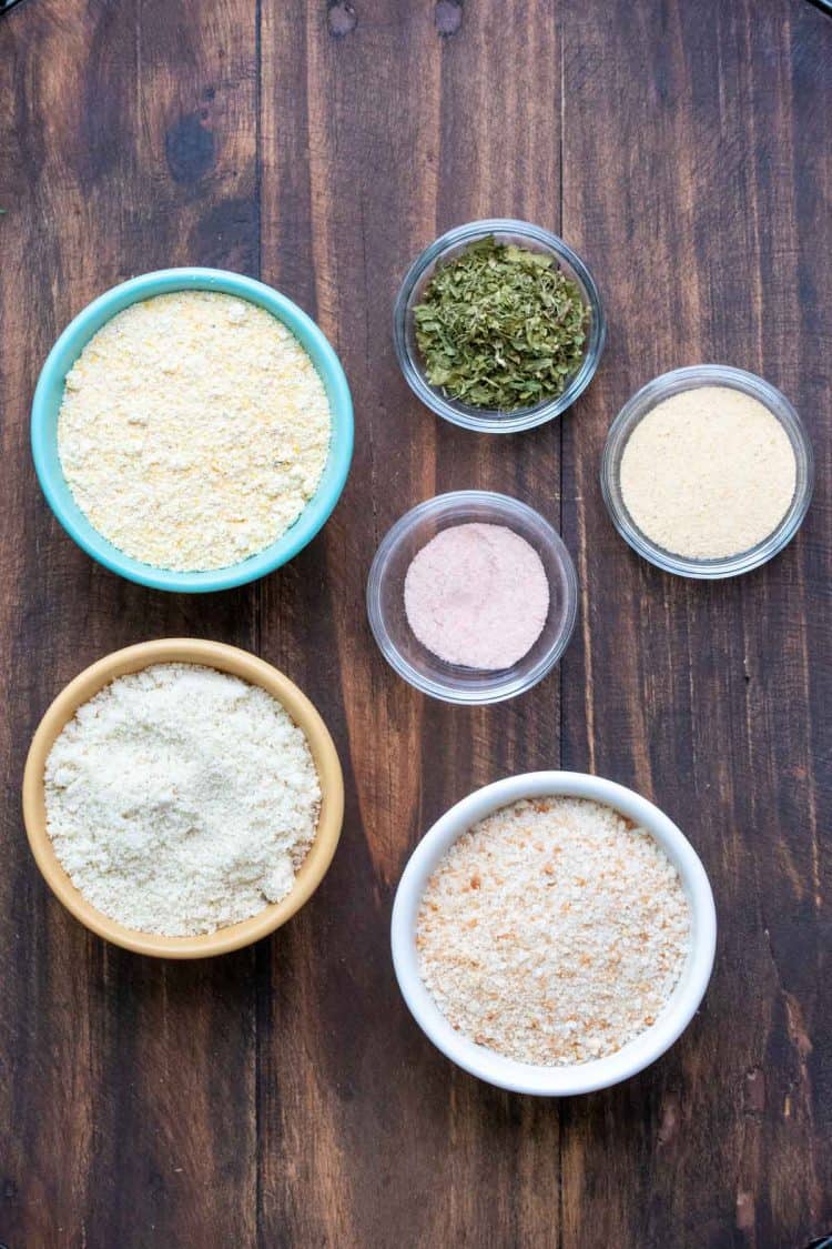 Bowls filled with ingredients for an onion ring crispy coating