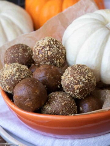 Orange bowl filled with pumpkin energy balls