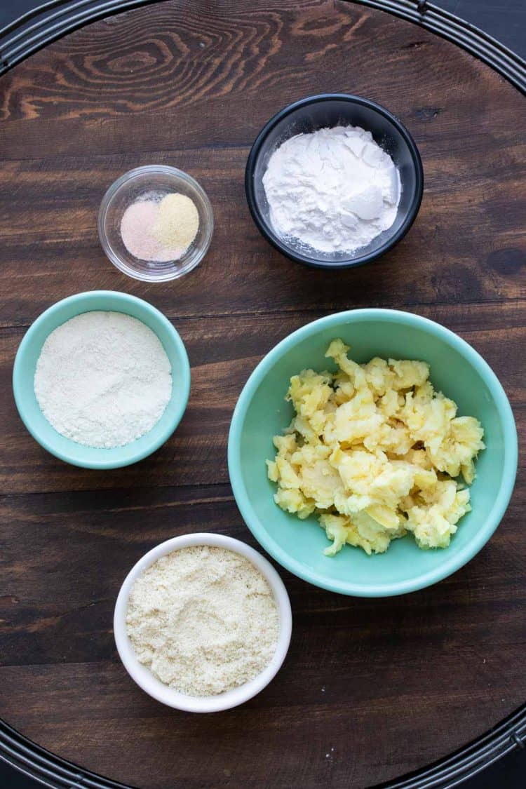 Bowls filled with ingredients to make sweet potato gnocchi