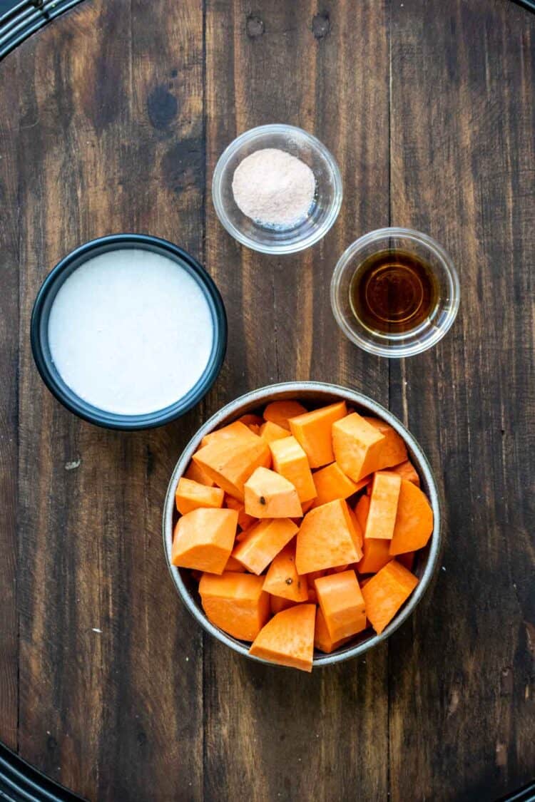 Bowls with chopped sweet potato, coconut milk, sea salt and vanilla extract.