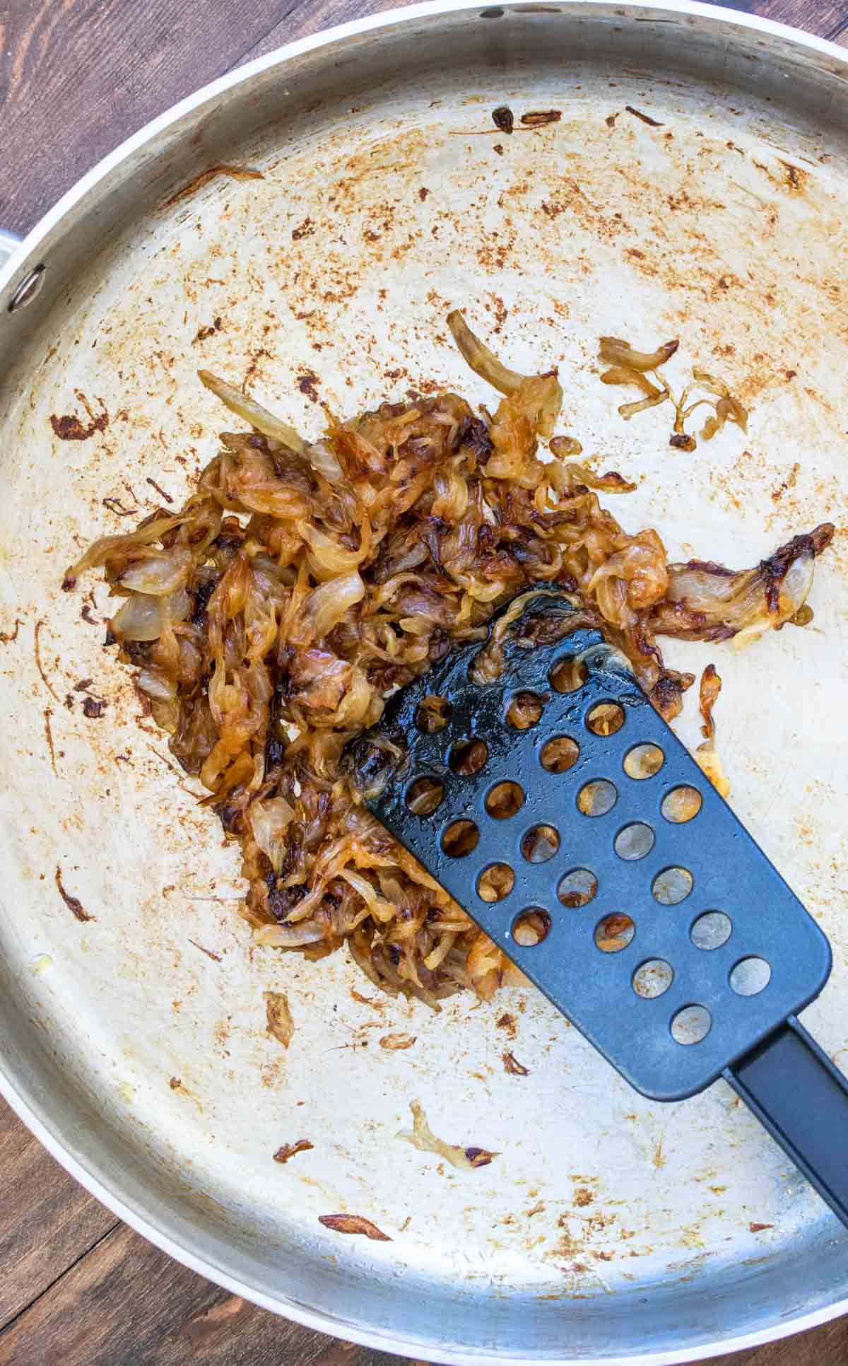 Onions being caramelized in a pan