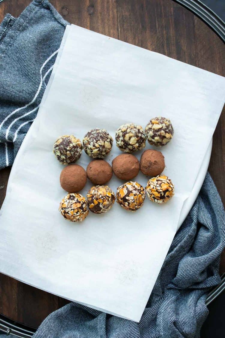 Rows of chocolate truffles rolled in different toppings