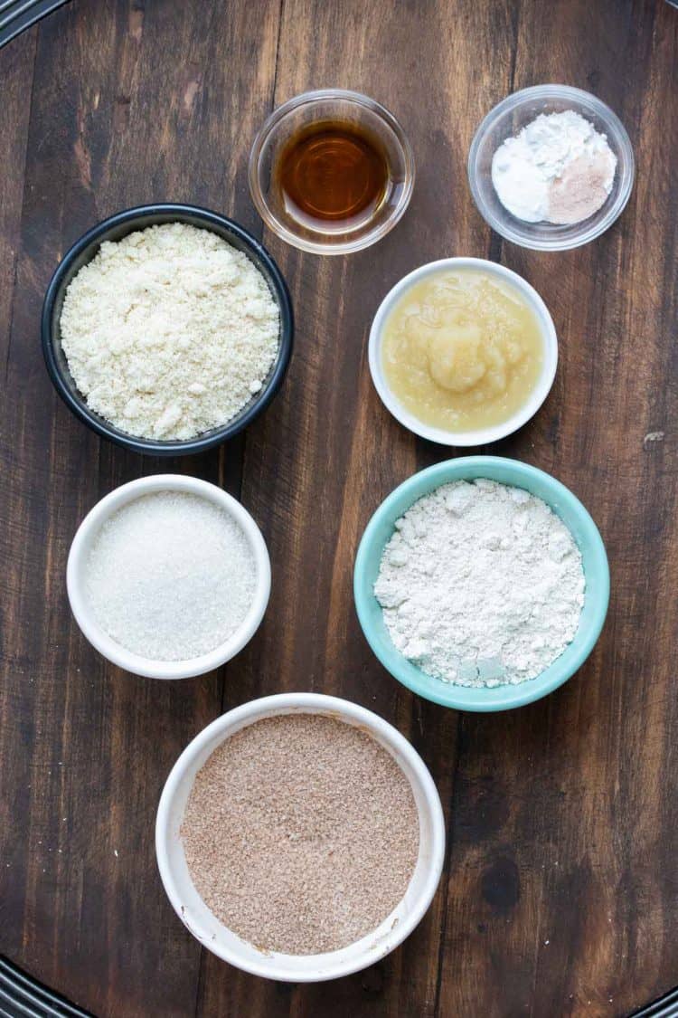 Different colored bowls filled with ingredients for snickerdoodles