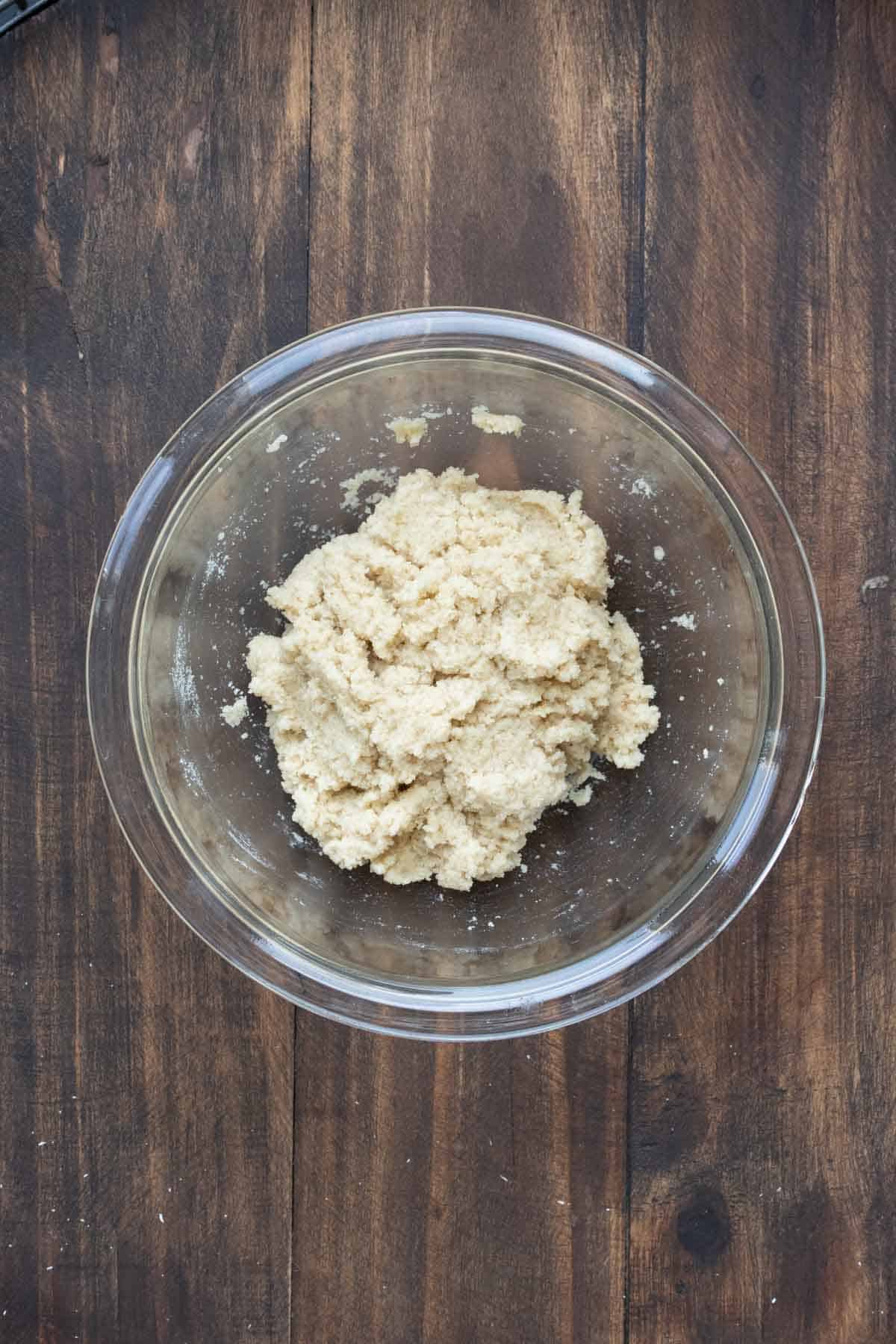 Raw snickerdoodle dough in a glass bowl