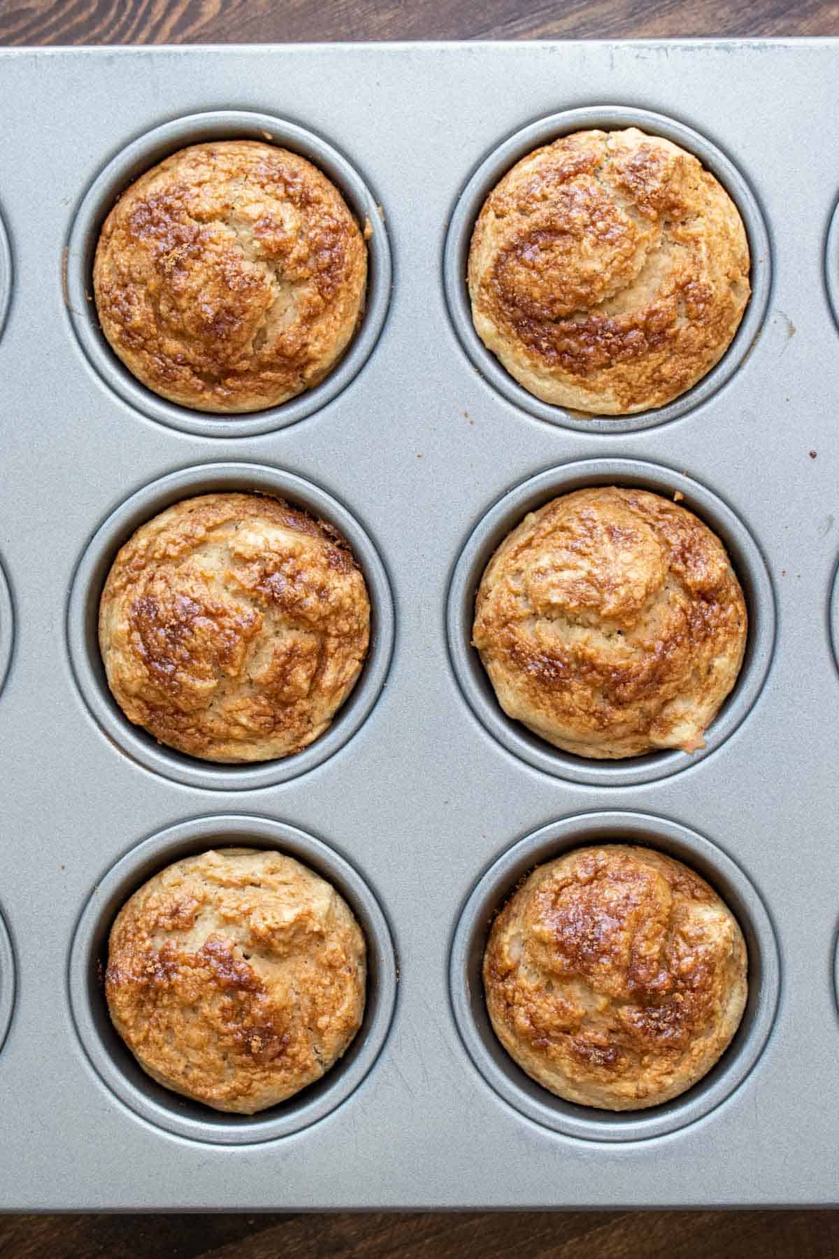 Top view of baked muffins in a muffin tin