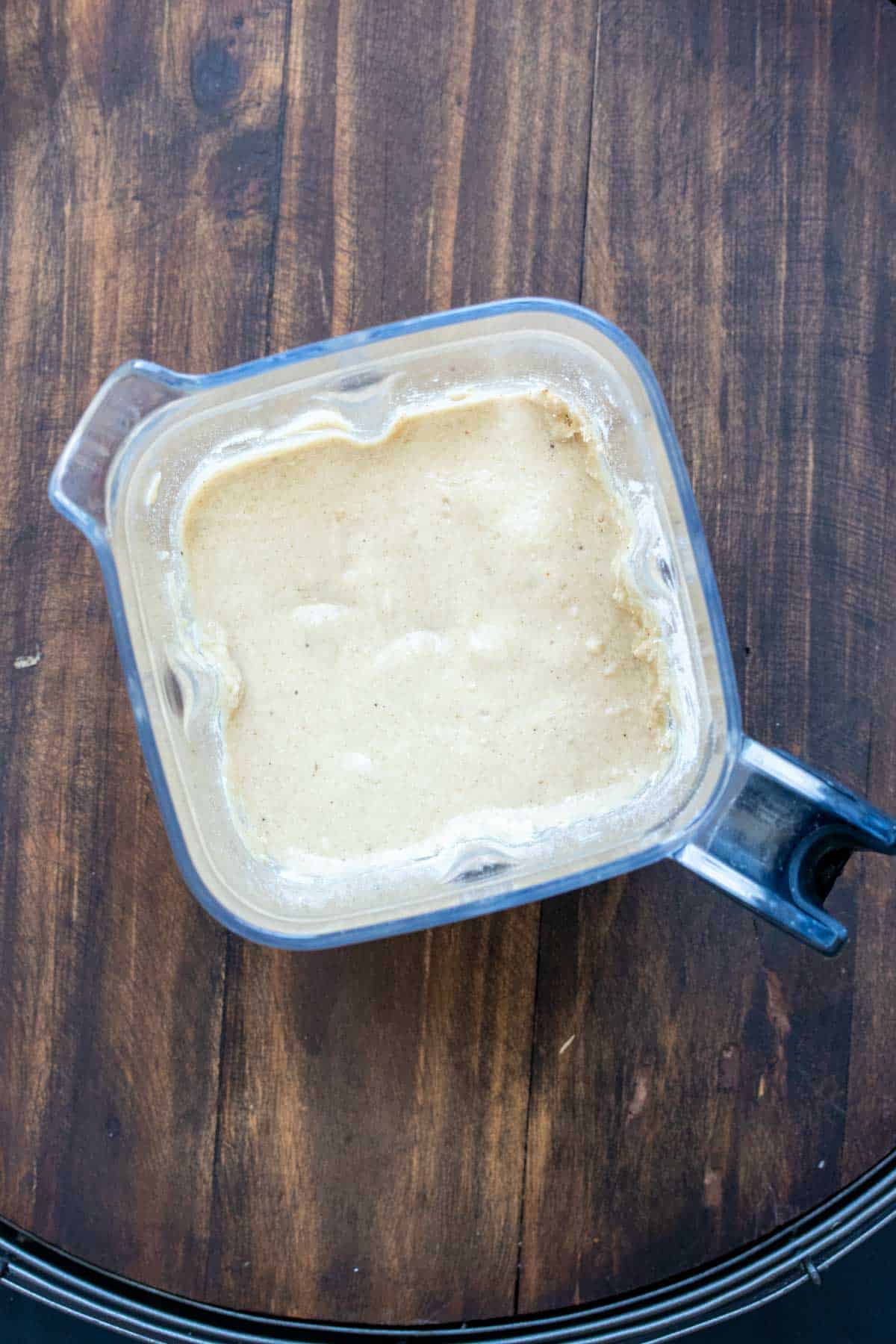 Top view of a blender with banana muffins batter inside