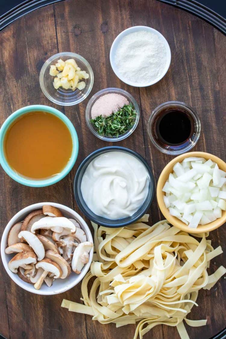 Different colored bowls filled with ingredients to make mushroom stroganoff