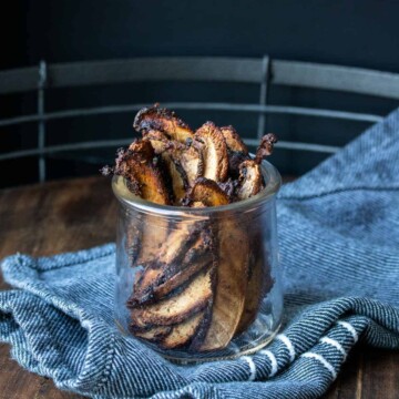 Crispy baked slices of portobello mushroom in a glass jar