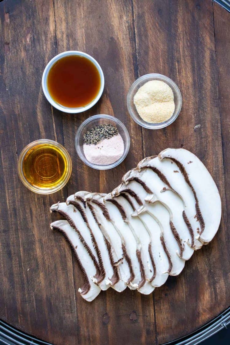 Ingredients to make a portobello mushroom based bacon on a wooden surface