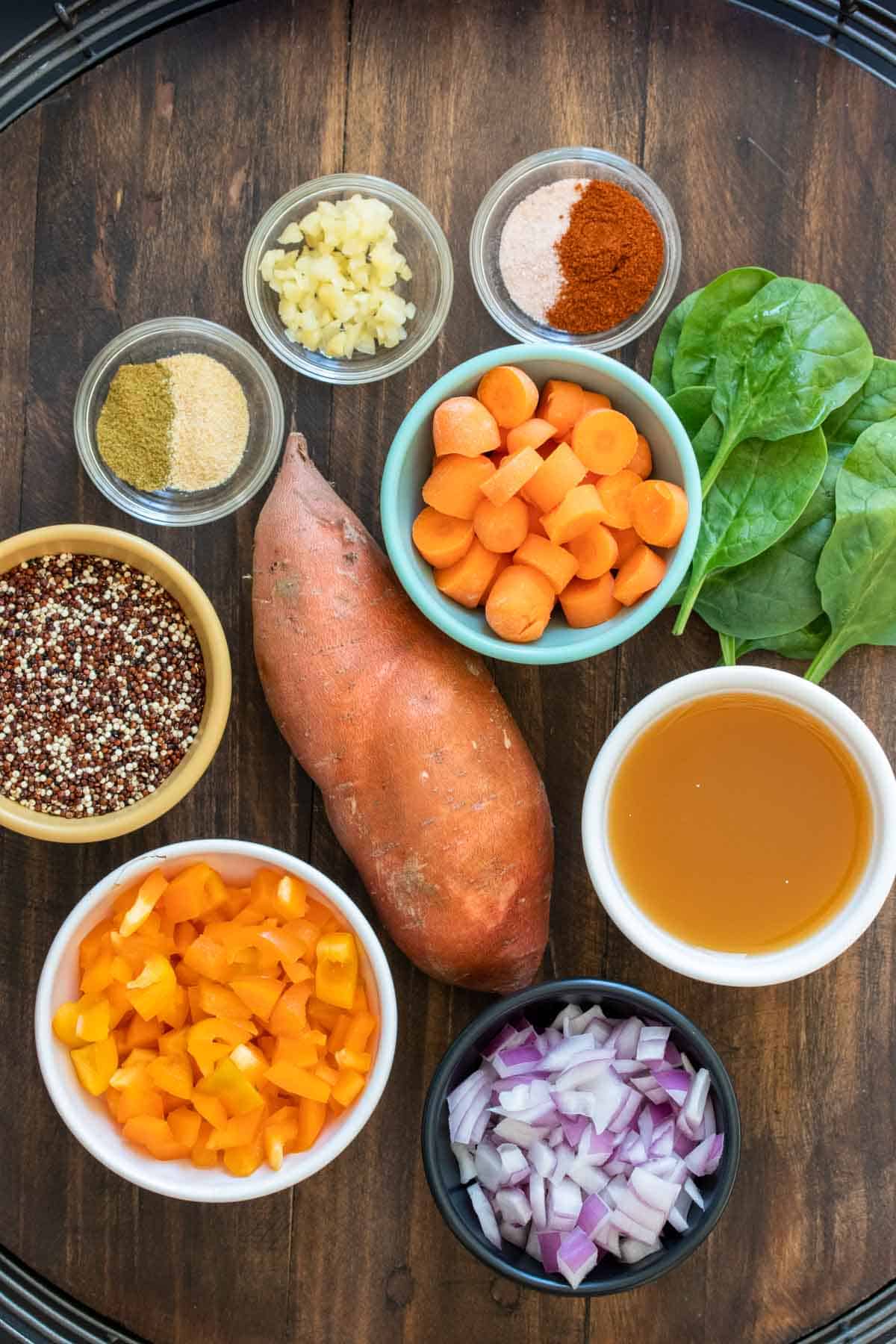 Wooden surface with ingredients for sweet potato soup