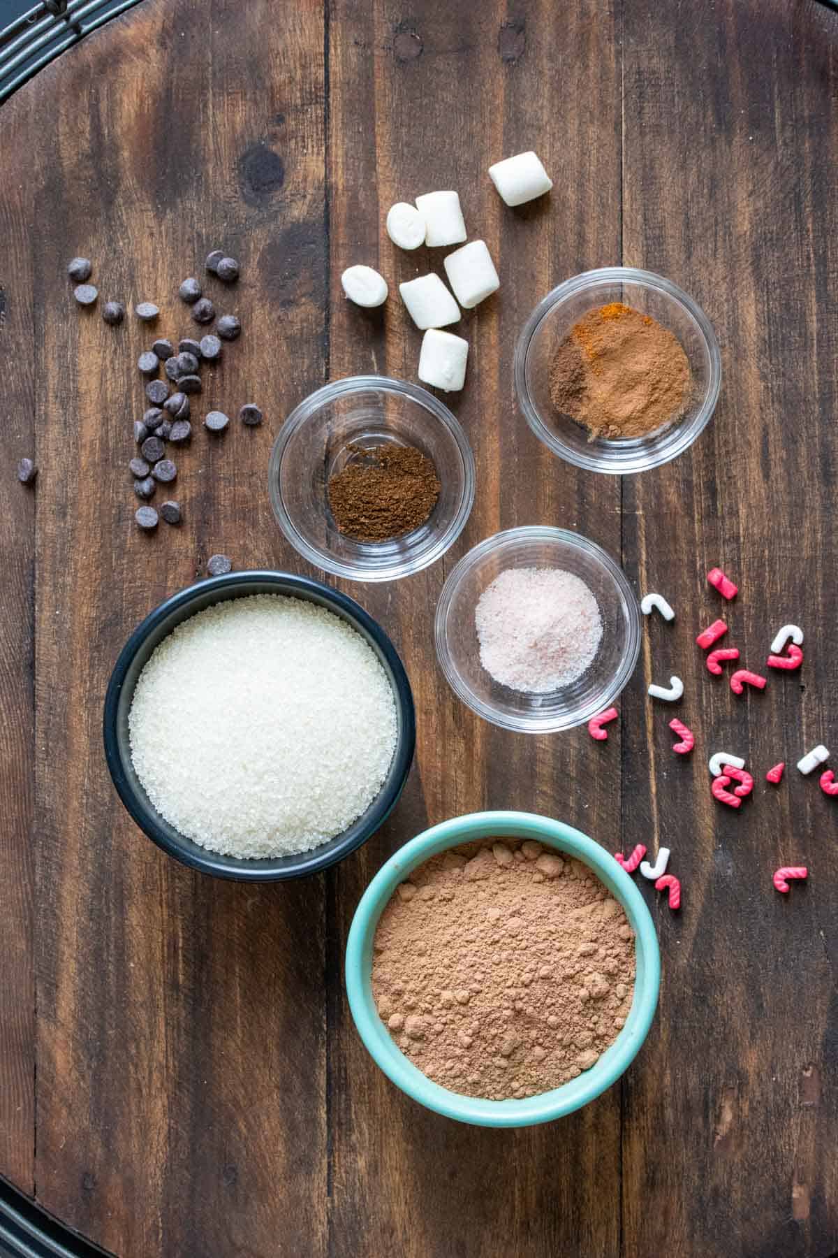 Different sized bowls with ingredients to make a homemade hot chocolate mix.