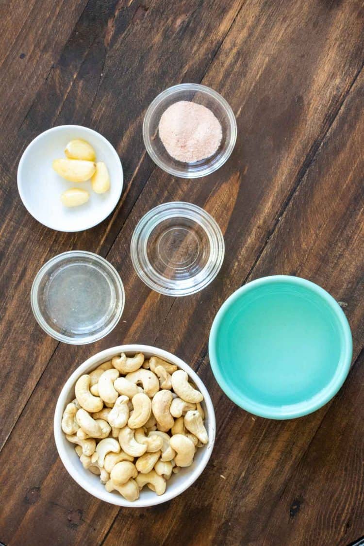 Bowls with ingredients needed to make a vegan garlic aioli