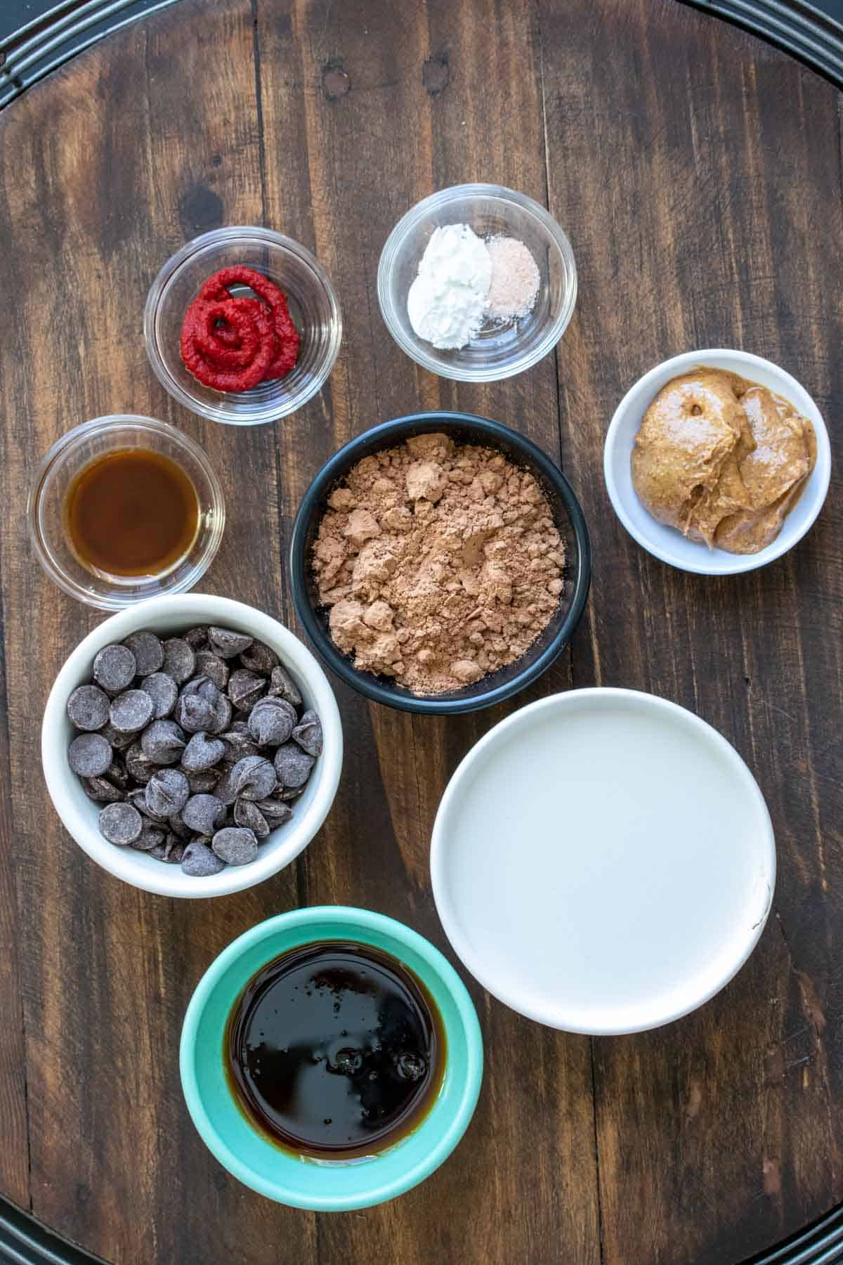 Bowls filled with ingredients to make a vegan chocolate lava cake.