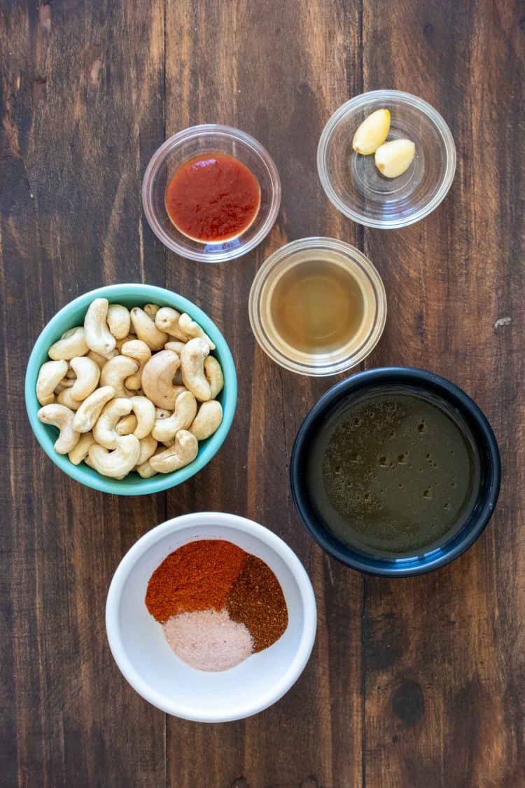 Different colored bowls with ingredients to make a dairy free creamy paprika sauce