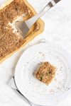 Top view of a baked cauliflower casserole in a yellow baking dish