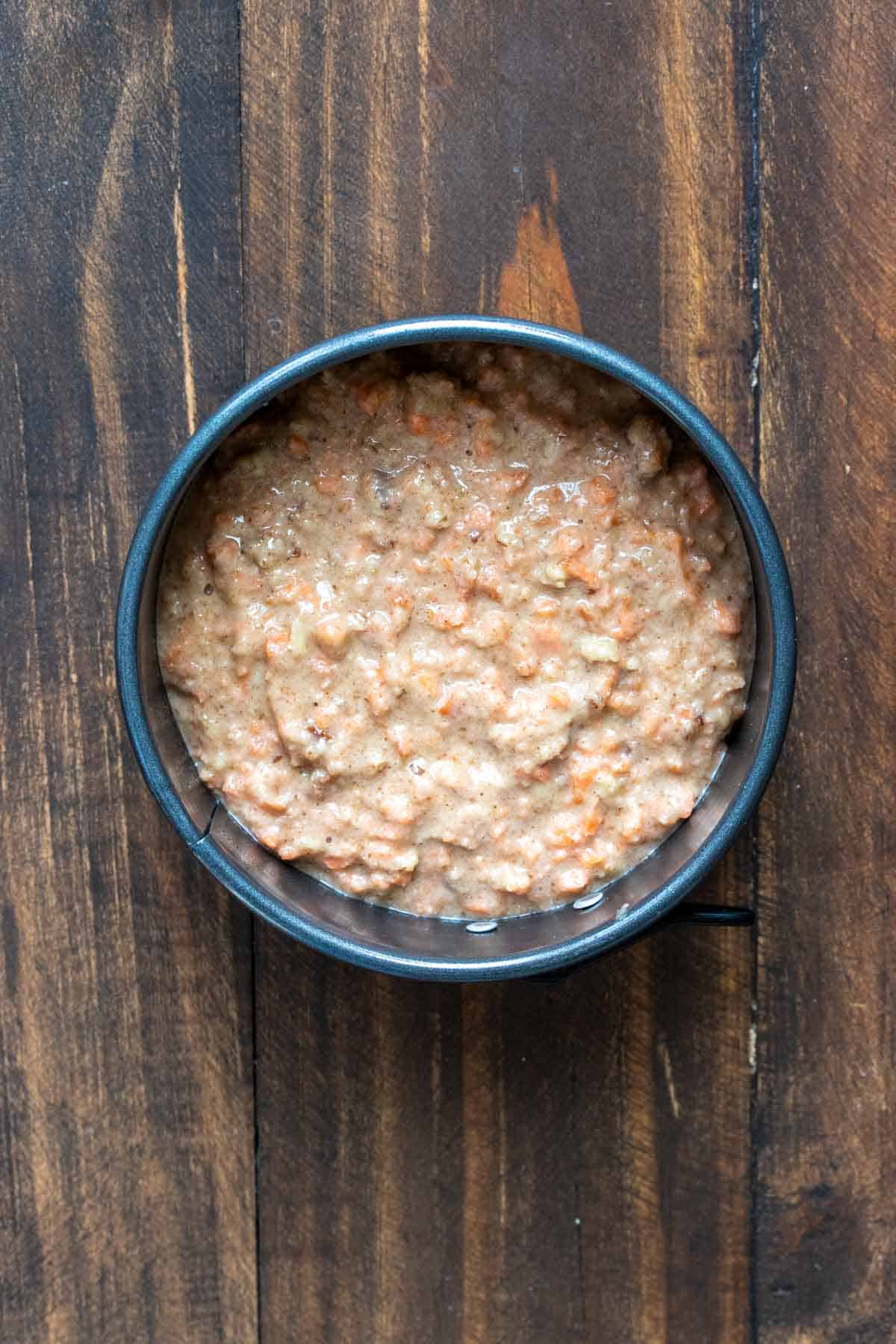 Carrot cake batter inside a cake pan