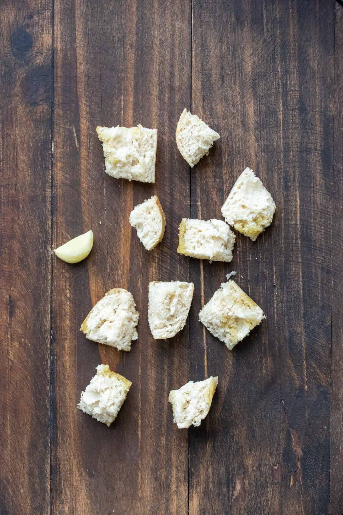 Cubes of bread on a wooden surface