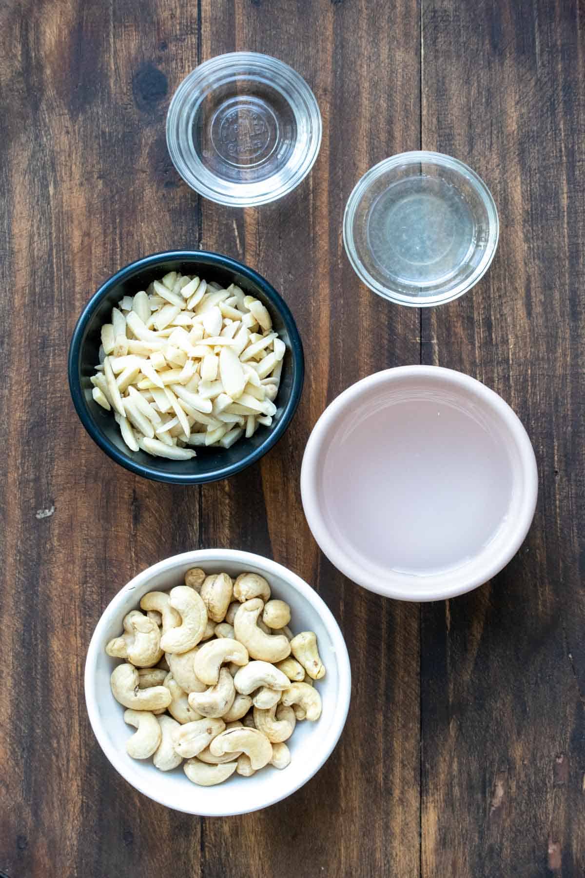 Bowls filled with ingredients to make a nut based dairy free sour cream