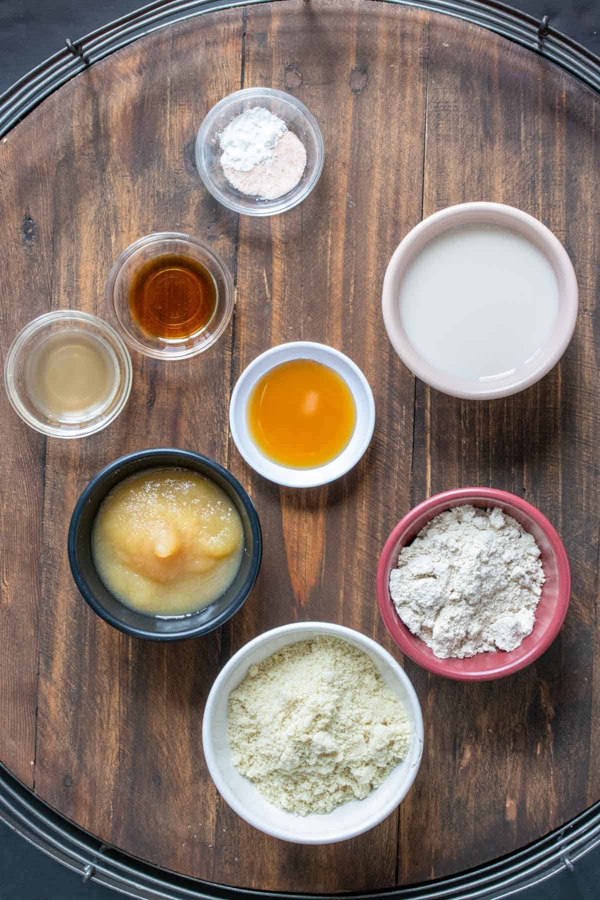 Different colored bowls with ingredients to make homemade vegan pancakes