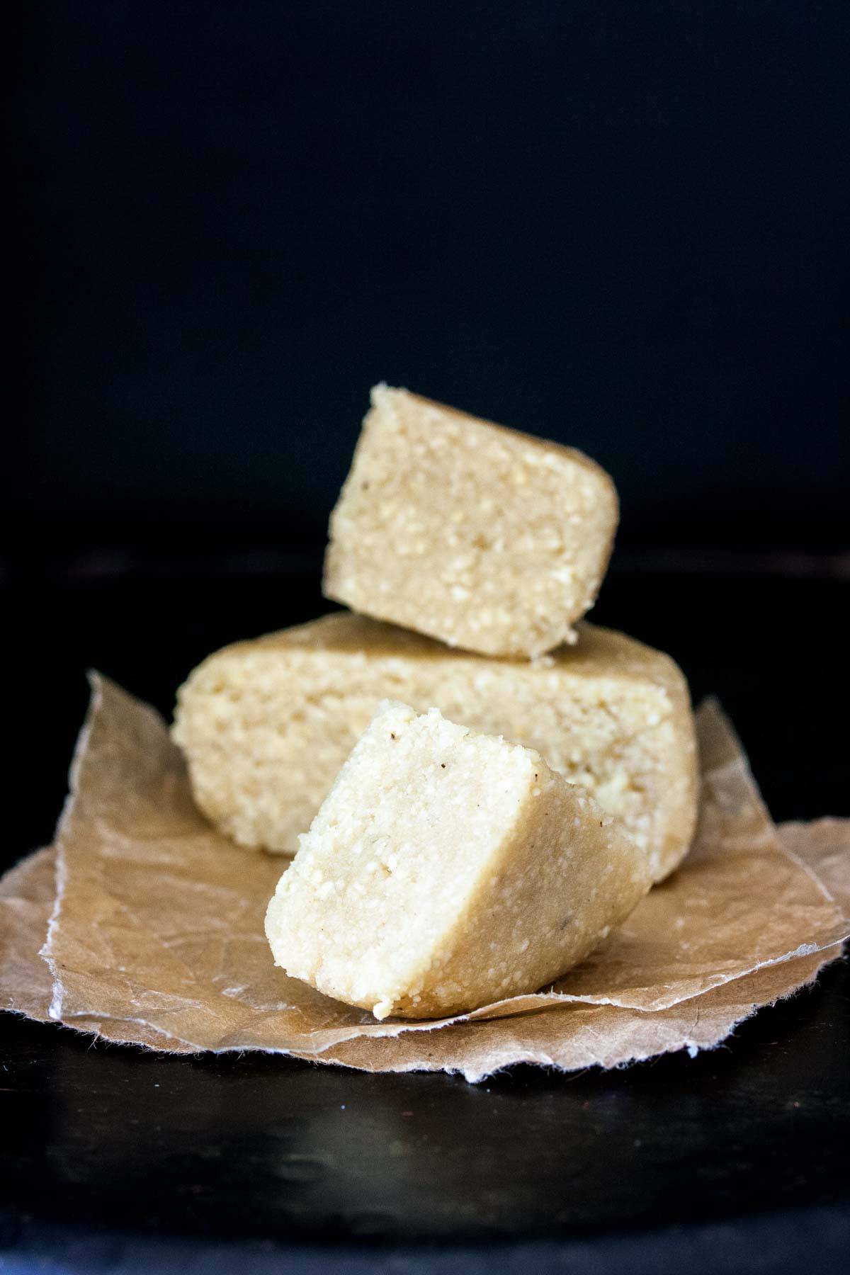 A pile of pieces from a Parmesan cheese block.