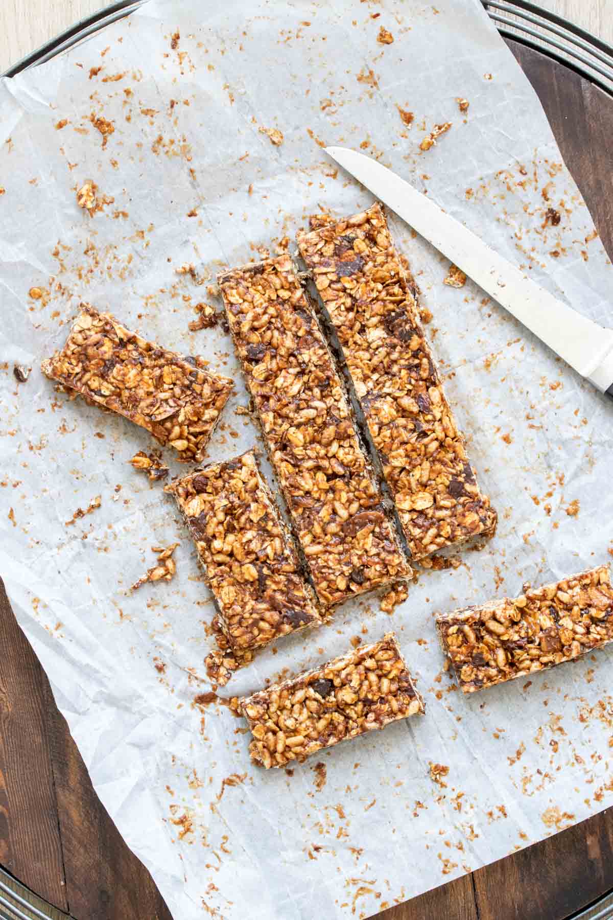 Homemade granola bars cut on a piece of parchment paper