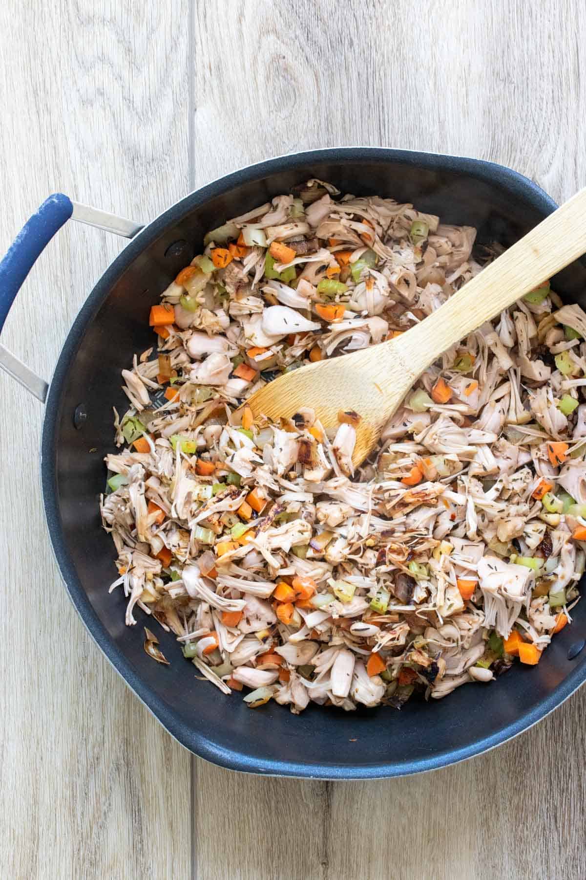 Jackfruit and chopped vegetables being cooked in a pan