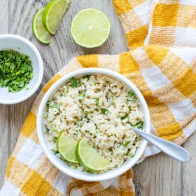 Yellow and white checkered towel with a white bowl of cilantro lime rice on it