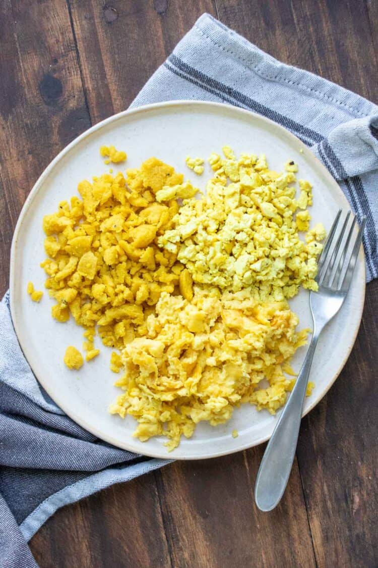 Plate with three types of vegan scrambled eggs on a cream plate