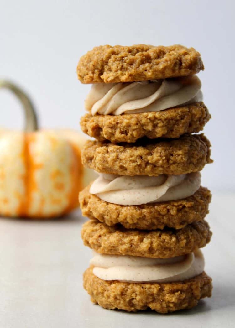 A pile of three whoopie pies with oatmeal cookies and cream filling