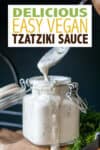 Overlay text on vegan tzatziki sauce with a glass jar filled with it and dripping off the side