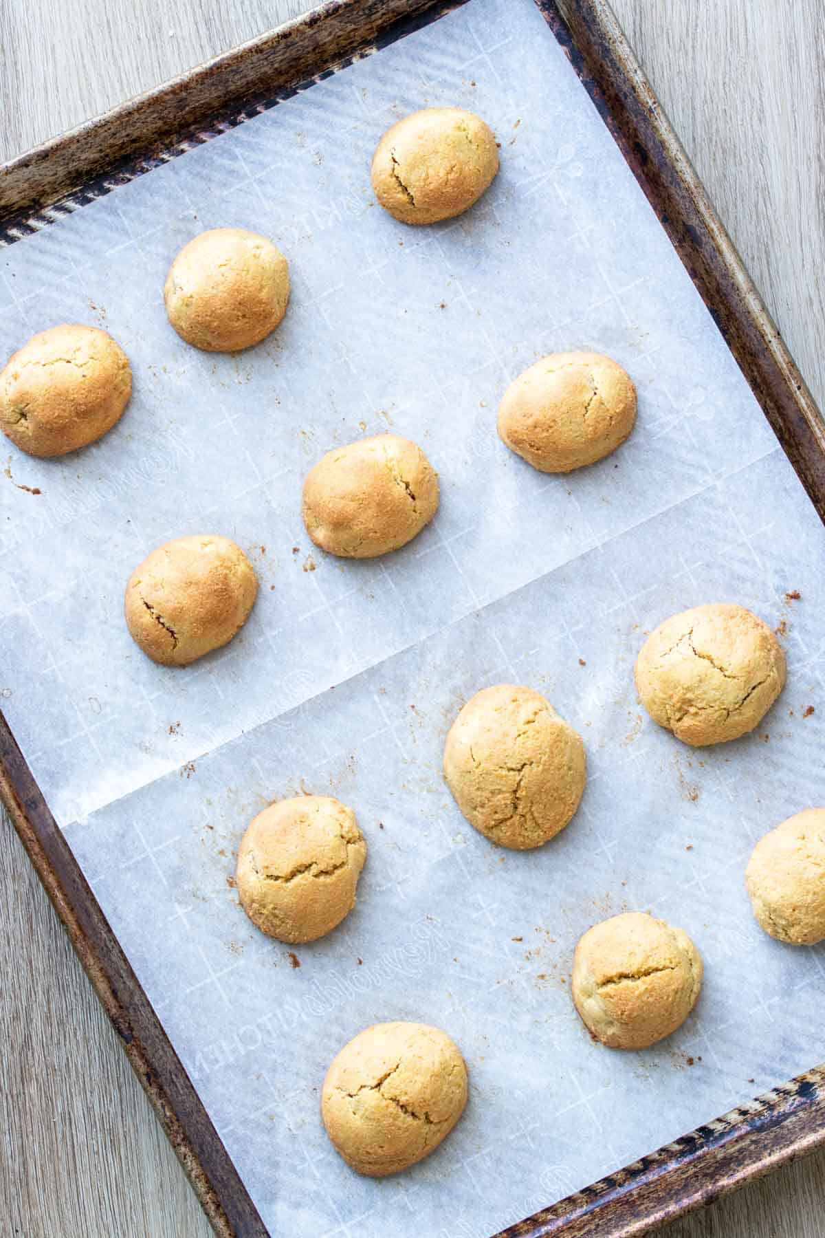 Baked mini corndog bites on a parchment lined baking sheet