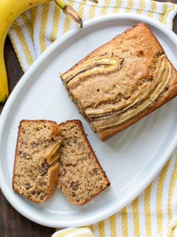 Top view of a banana bread loaf and two slices