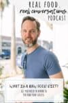 A man in a blue shirt with a beard and short hair with overlay text on a raw food diet